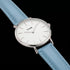 Close-up of Cluse La Boheme silver white/pastel baby blue watch.