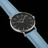 Close-up of Cluse La Boheme silver black/pastel baby blue watch.