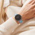 Woman wearing Cluse La Boheme silver black/pastel baby blue watch.