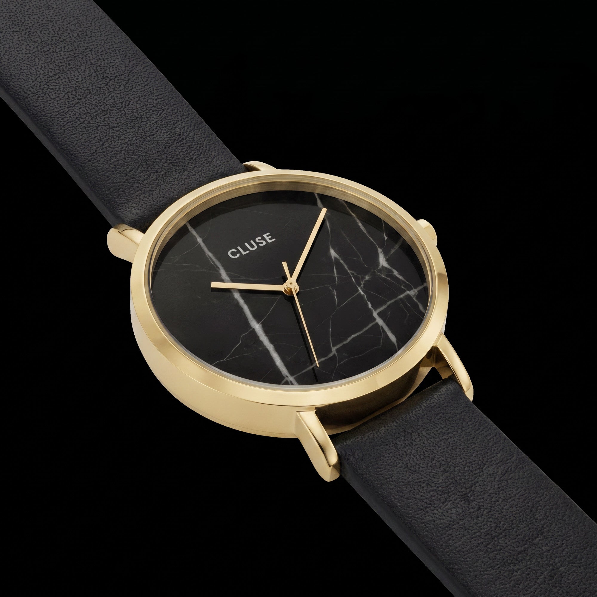 Close-up of Cluse La Roche gold black marble/black watch.