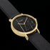 Close-up of Cluse La Roche gold black marble/black watch.