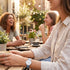 Woman wearing Cluse Minuit silver/white baby blue watch at an outdoor cafe.