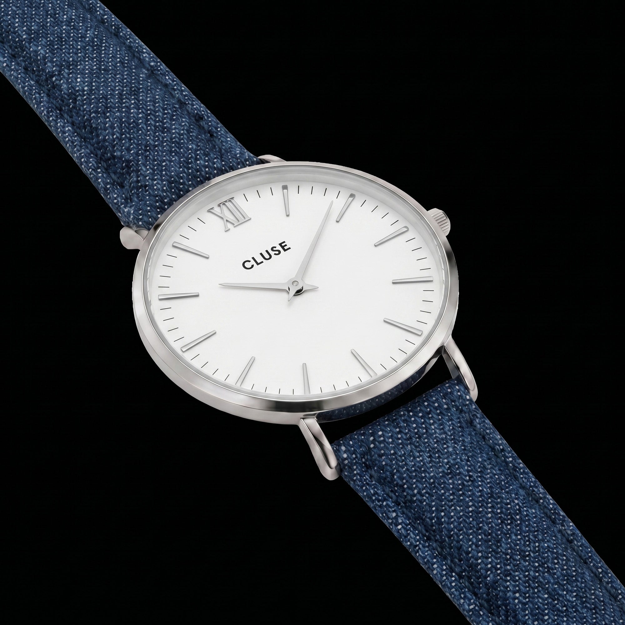 Close-up of Cluse Minuit silver/white denim watch.