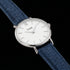 Close-up of Cluse Minuit silver/white denim watch.