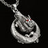 Close-up of a coiled dragon stainless steel necklace.
