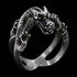 Angle side view of a coiled dragon men's stainless steel ring.