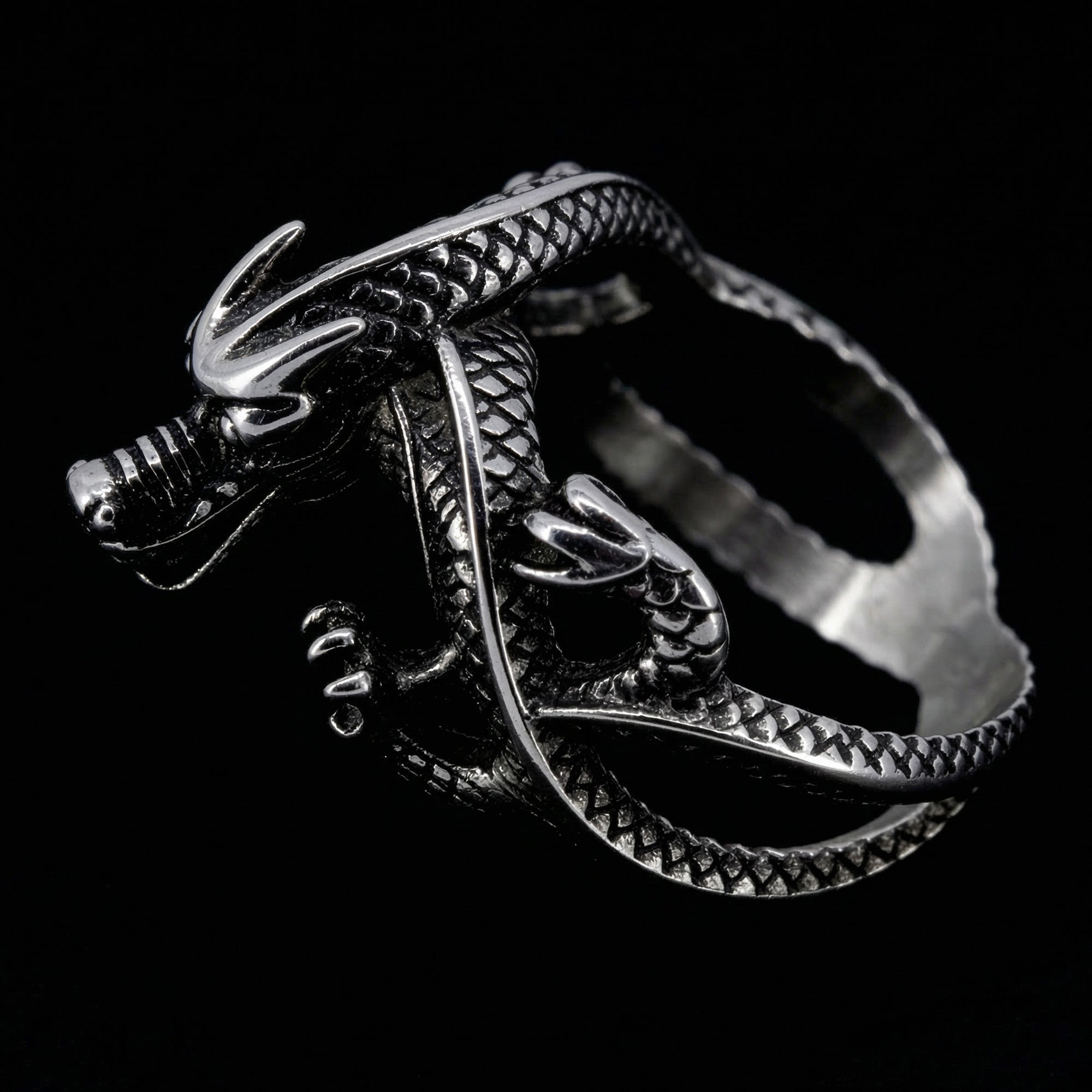 Side view of a coiled dragon men's stainless steel ring.
