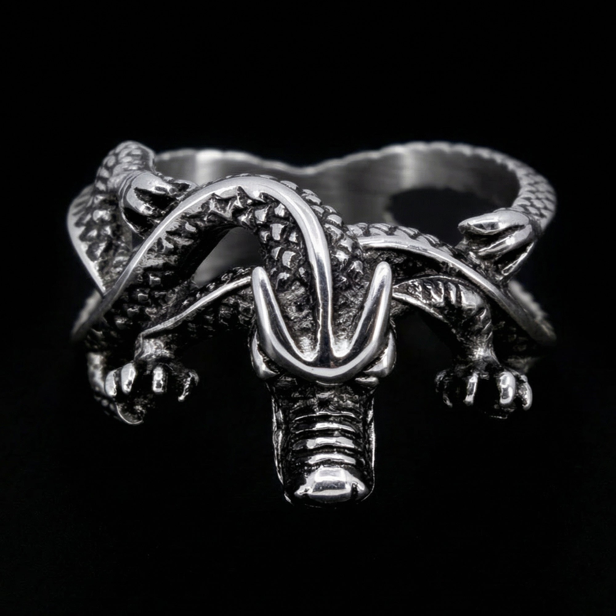 Top view of a coiled dragon men's stainless steel ring.
