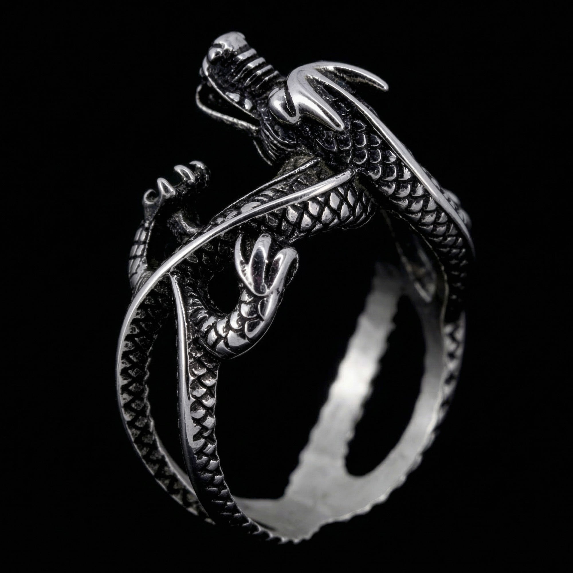Upright side view of a coiled dragon men's stainless steel ring.