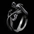 Upright side view of a coiled dragon men's stainless steel ring.