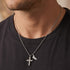 Man in a dark grey t-shirt wearing Save Brave faith cross & wing stainless steel necklace.