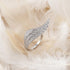 Engelsrufer Silver Adjustable Crystal Angel Wing Ring Laying On White Feathers
