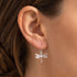 Woman wearing Engelsrufer dragonfly filigree silver hook earrings.