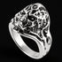 Tilt view of exoskeleton skull men's stainless steel ring.