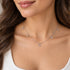 Woman wearing Engelsrufer faith love hope sterling silver charm necklace.
