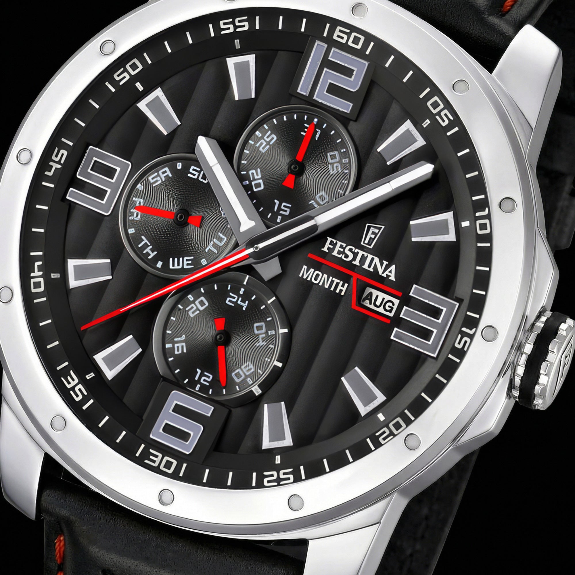 Festina men's red black dial multifunction leather watch dial close-up.