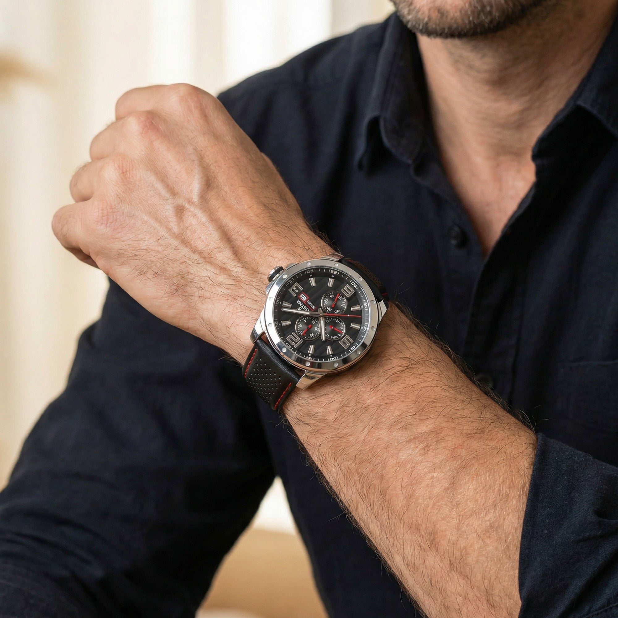 Man wearing Festina men's red black dial multifunction leather watch.