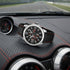 Festina men's red black dial multifunction leather watch on the leather dashboard of a racing car.