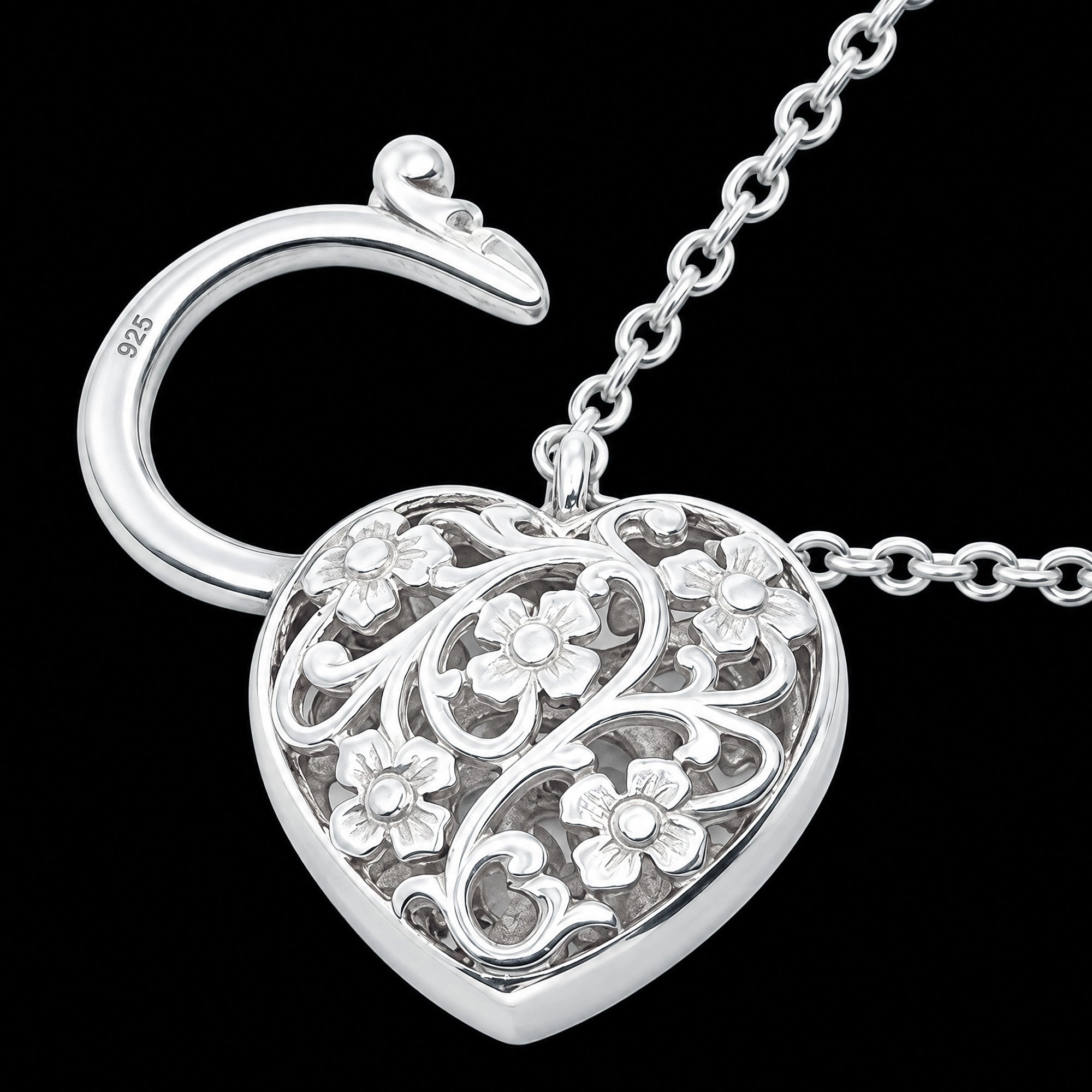 Close-up of the back of a filigree heart padlock CZ sterling silver belcher chain bracelet.
