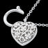 Close-up of the back of a filigree heart padlock CZ sterling silver belcher chain bracelet.