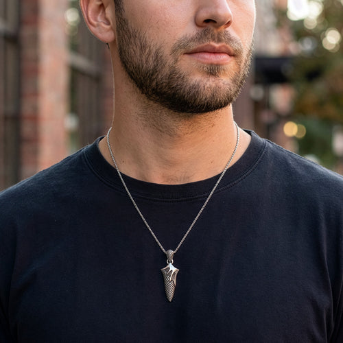 Man wearing flaming dagger stainless steel necklace.