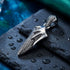 Flaming dagger men's stainless steel necklace on black slate.