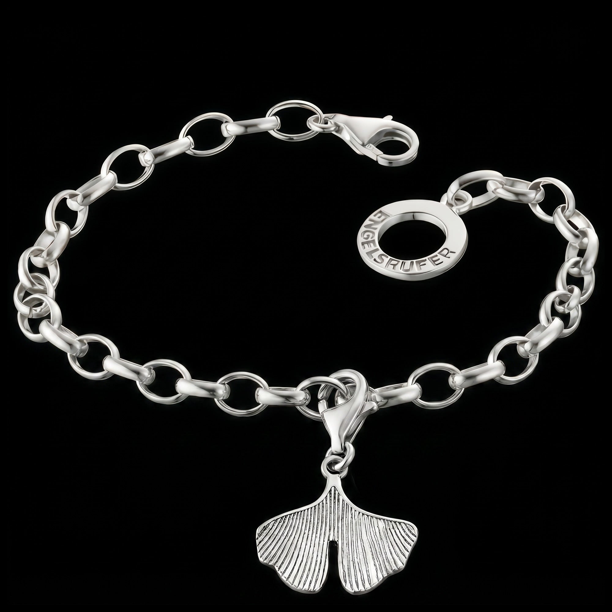 Engelsrufer ginkgo silver charm attached to a silver link bracelet.