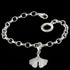 Engelsrufer ginkgo silver charm attached to a silver link bracelet.