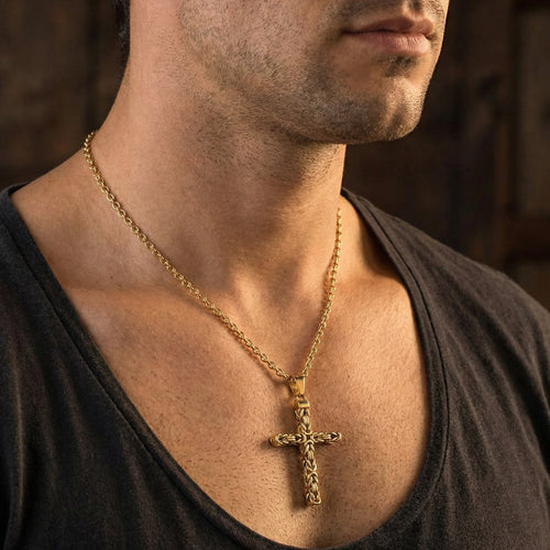 Close-up of young man wearing Byzantine rope knot cross gold stainless steel necklace.