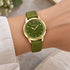 Woman wearing Gregio Porto Grace olive green watch on her wrist.
