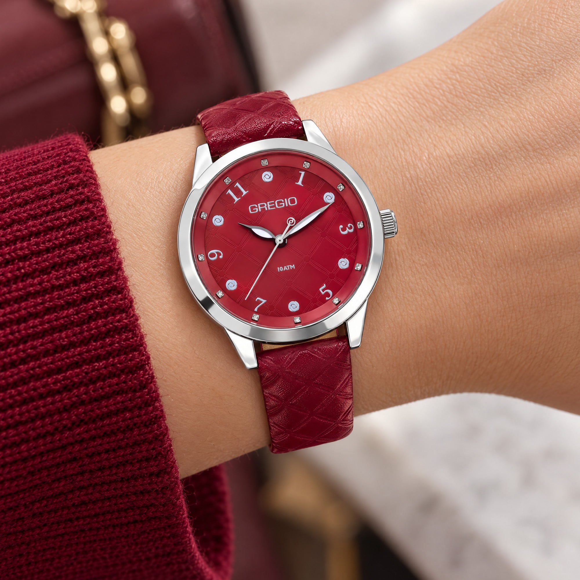 Woman wearing Gregio Porto Grace marsala watch on her wrist.