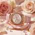 Guess Limelight rose gold ladies dress watch surrounded by roses.