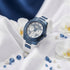 Guess Luna sky blue ladies sport watch on white fabric with gemstones and pearls.