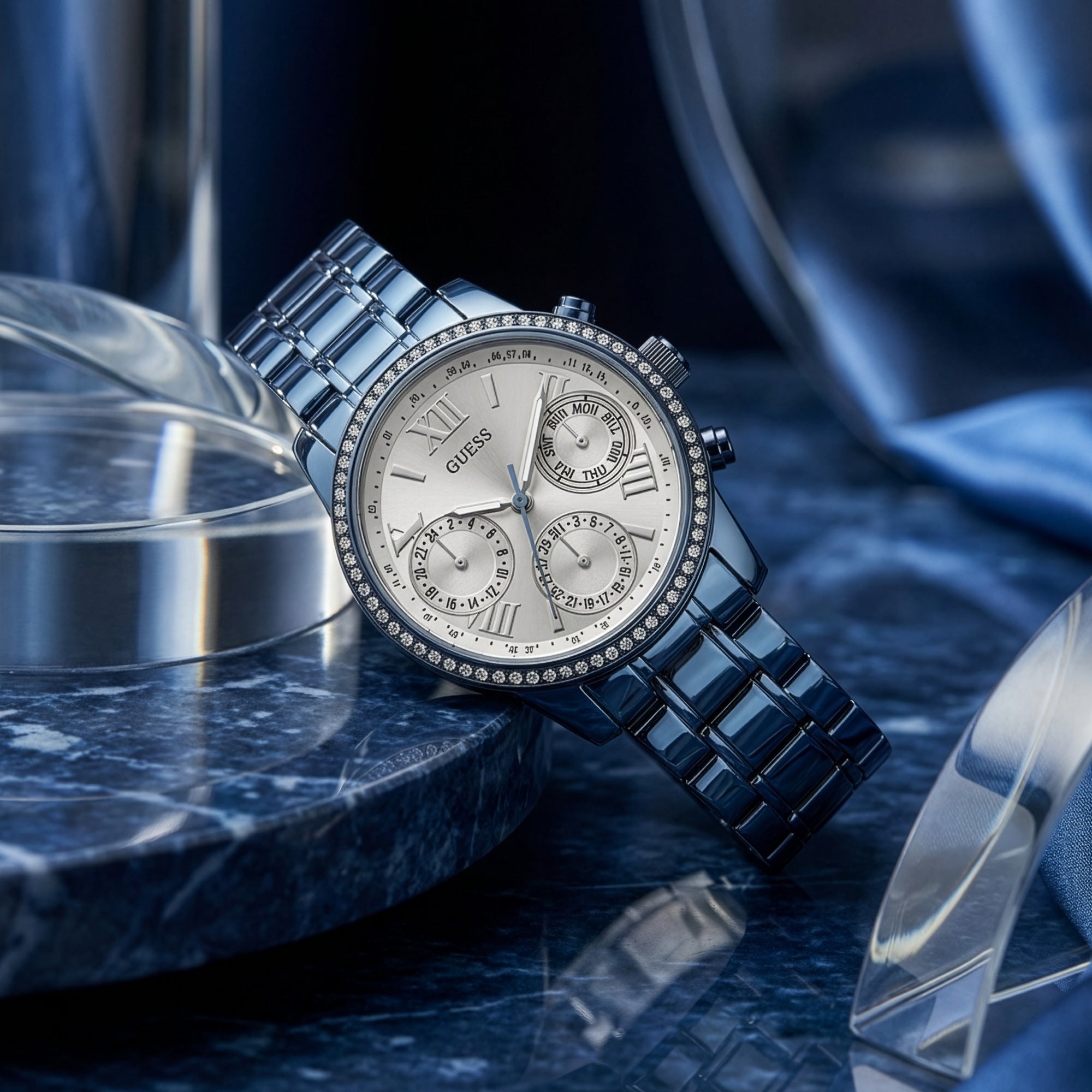 Guess Mini Sunrise sky blue ladies sport watch on blue marble table.