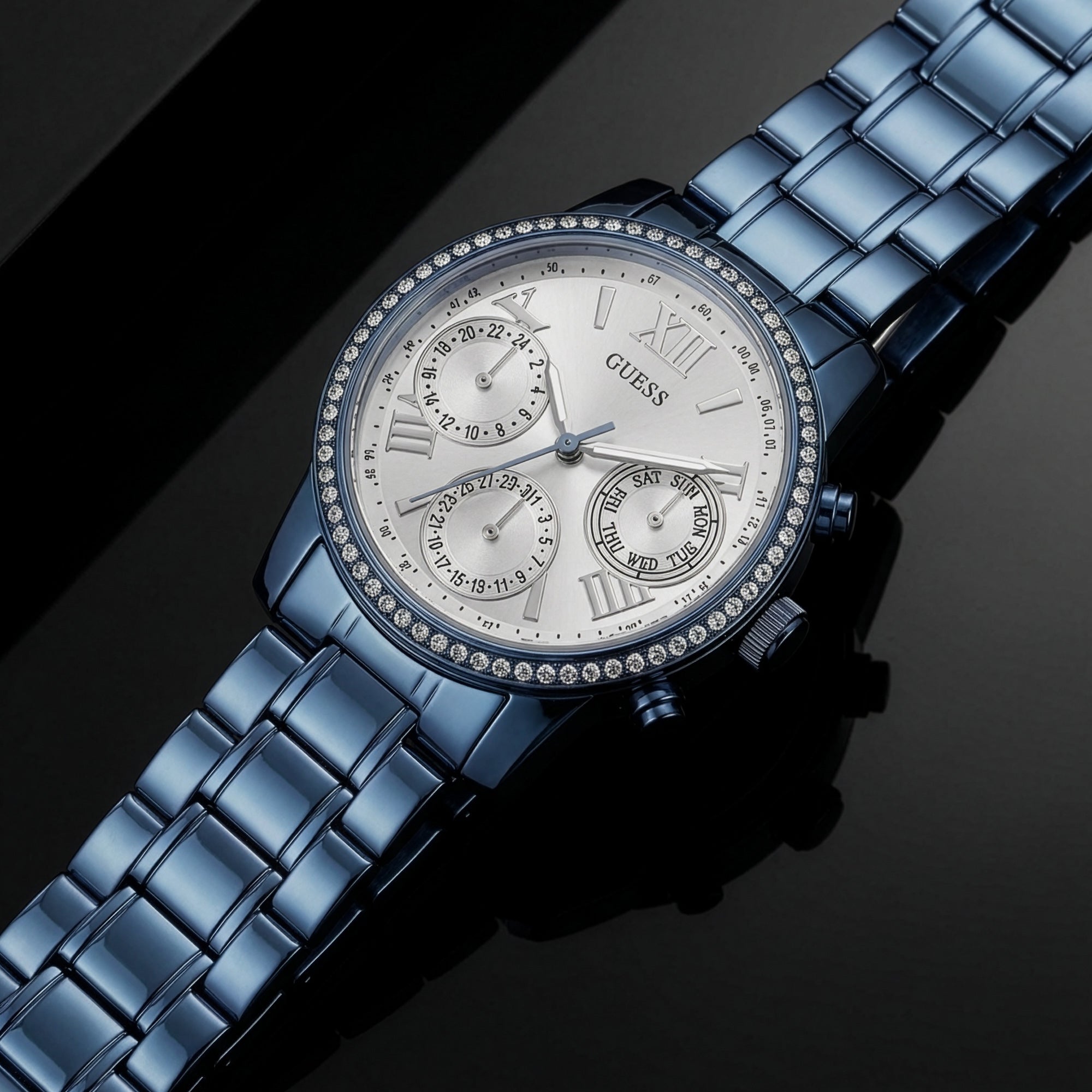 Guess Mini Sunrise sky blue ladies sport watch on mirror table.