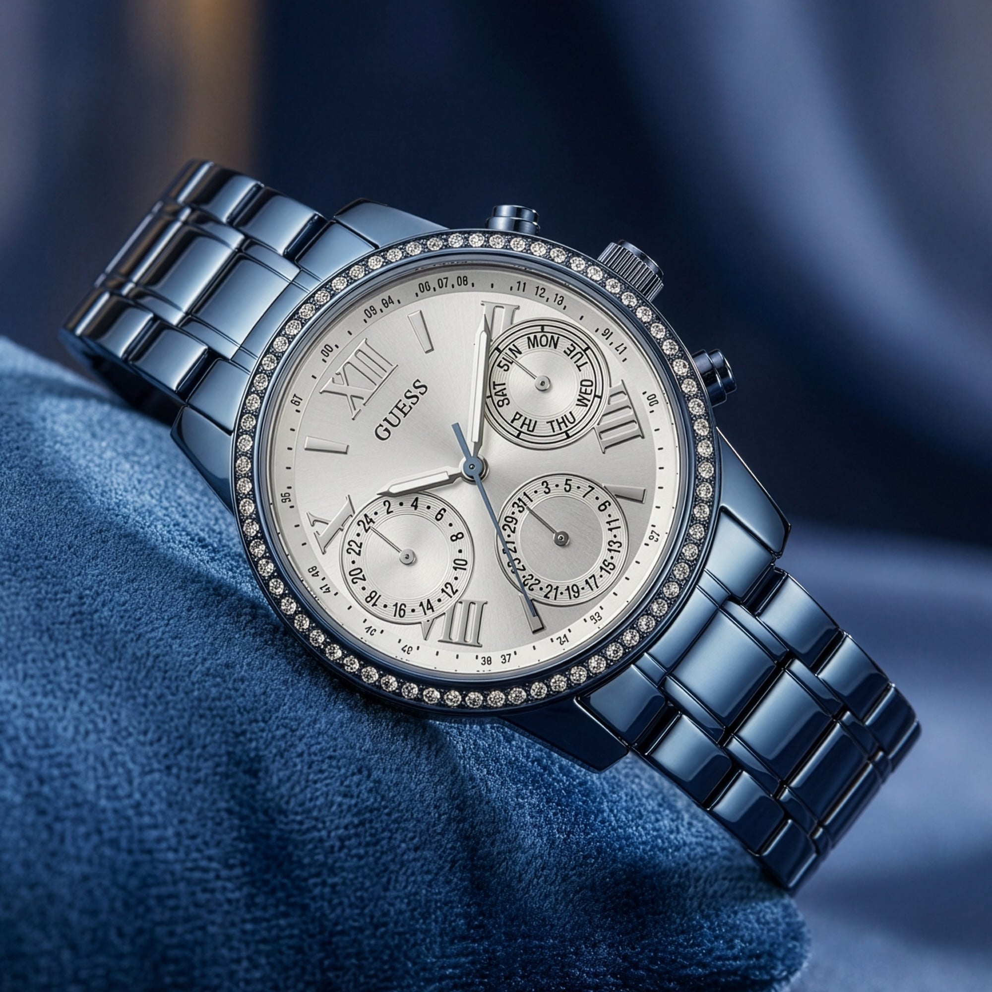 Guess Mini Sunrise sky blue ladies sport watch on blue velvet cushion.