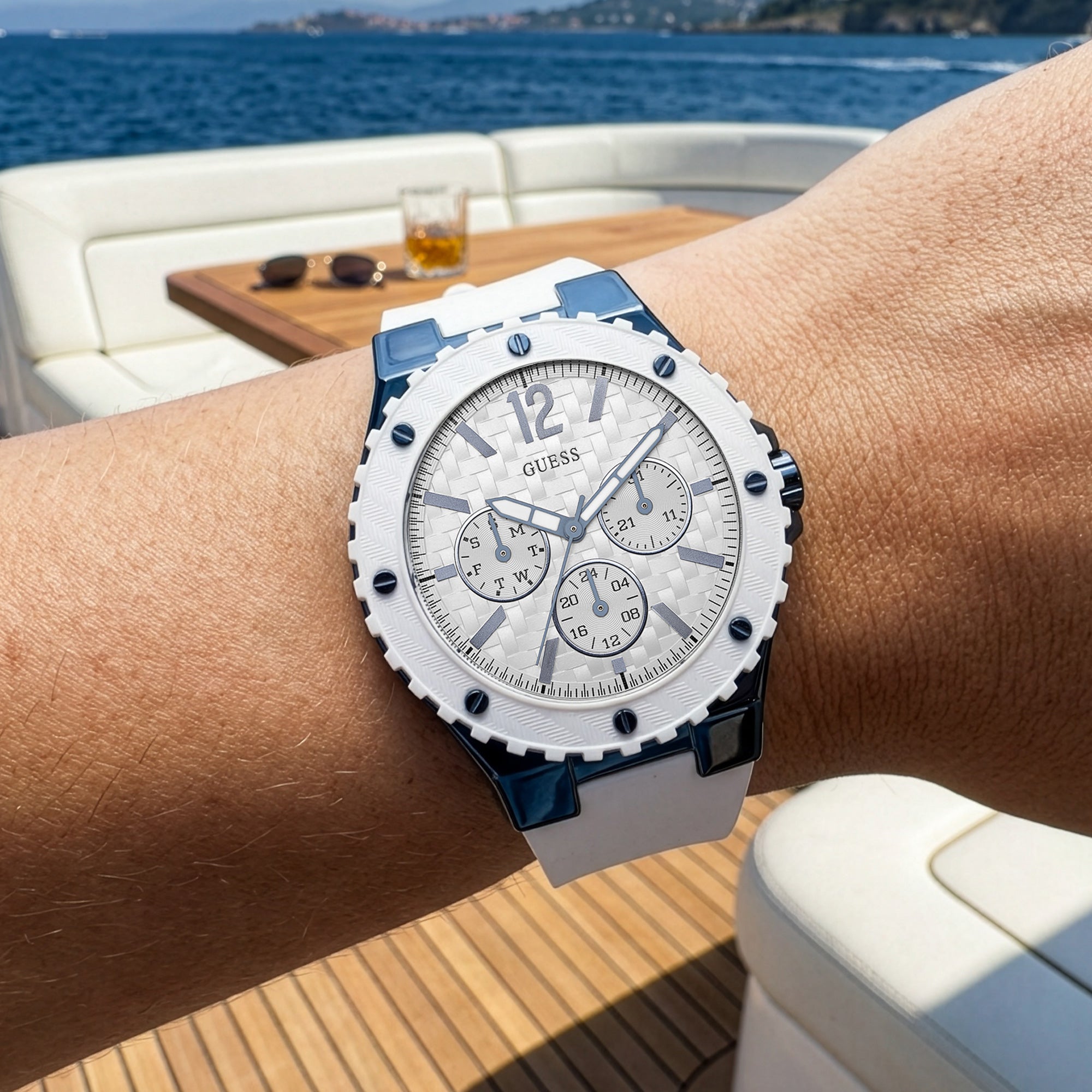 Woman wearing Guess Overdrive sky blue ladies sport watch.