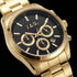 Dial close-up of a JAG Acton men's black dial gold watch.