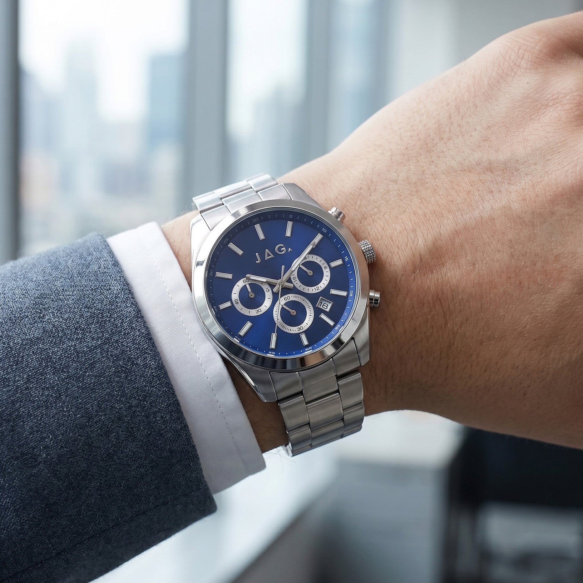 Man wearing JAG Acton men's blue dial silver watch on his wrist.