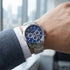 Man wearing JAG Acton men's blue dial silver watch on his wrist.