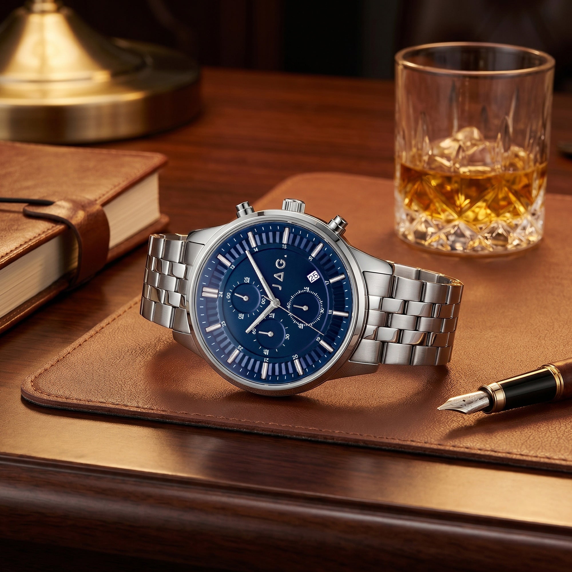 JAG Albany men's blue dial silver watch on a wooden desktop in a man's study.