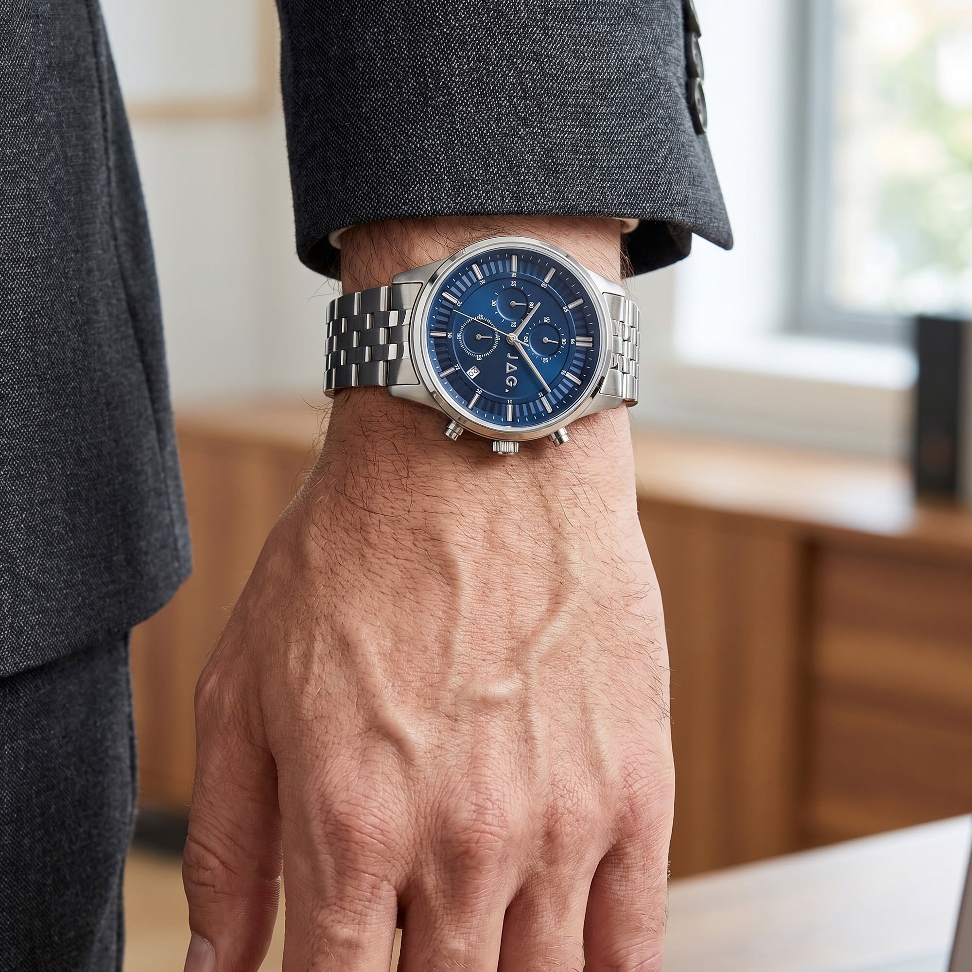 Man wearing JAG Albany men's blue dial silver watch.
