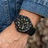 Man wearing a JAG Beachport black sport chronograph men's watch.