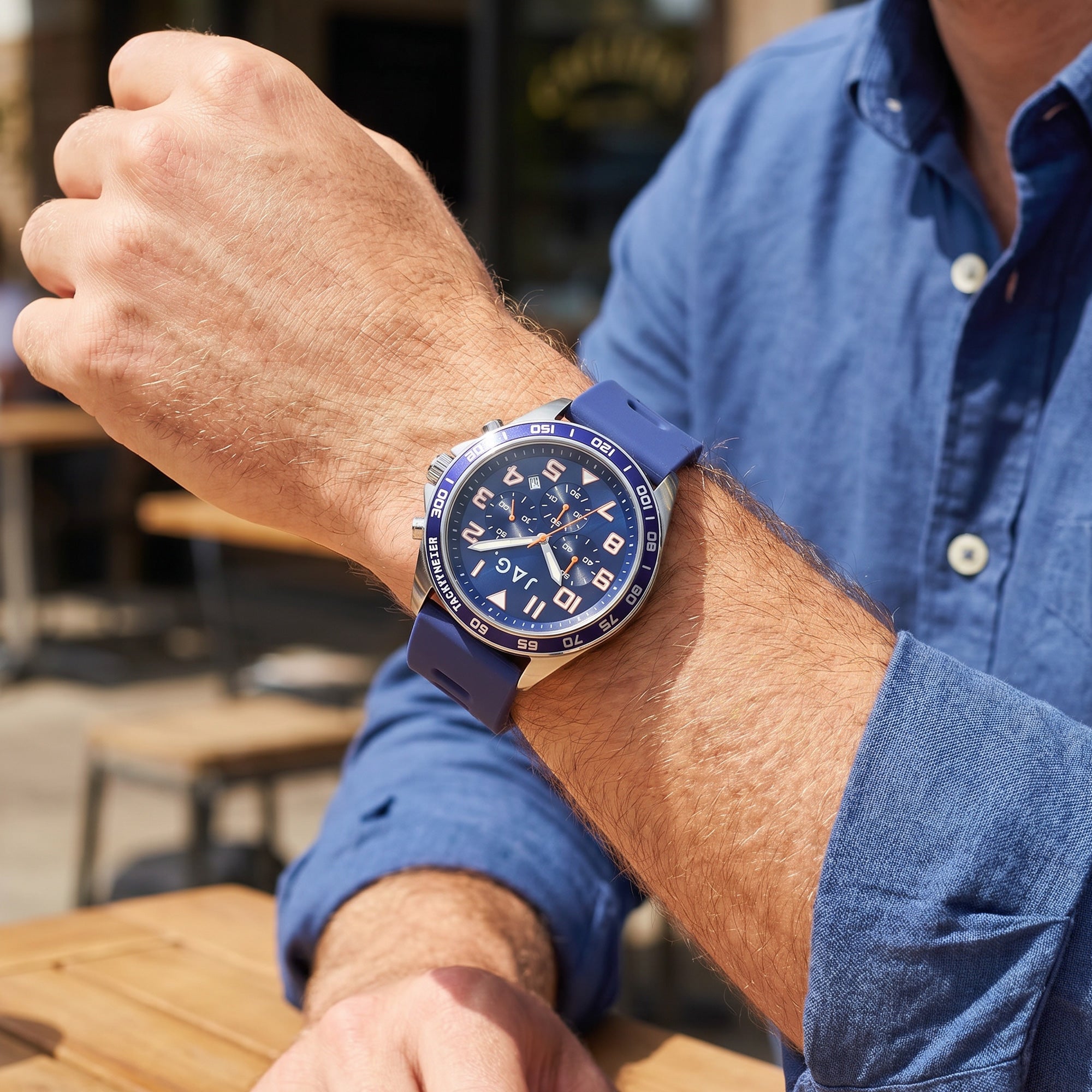 Man in a blue denim shirt wearing JAG Beachport blue men's sport chronograph watch.