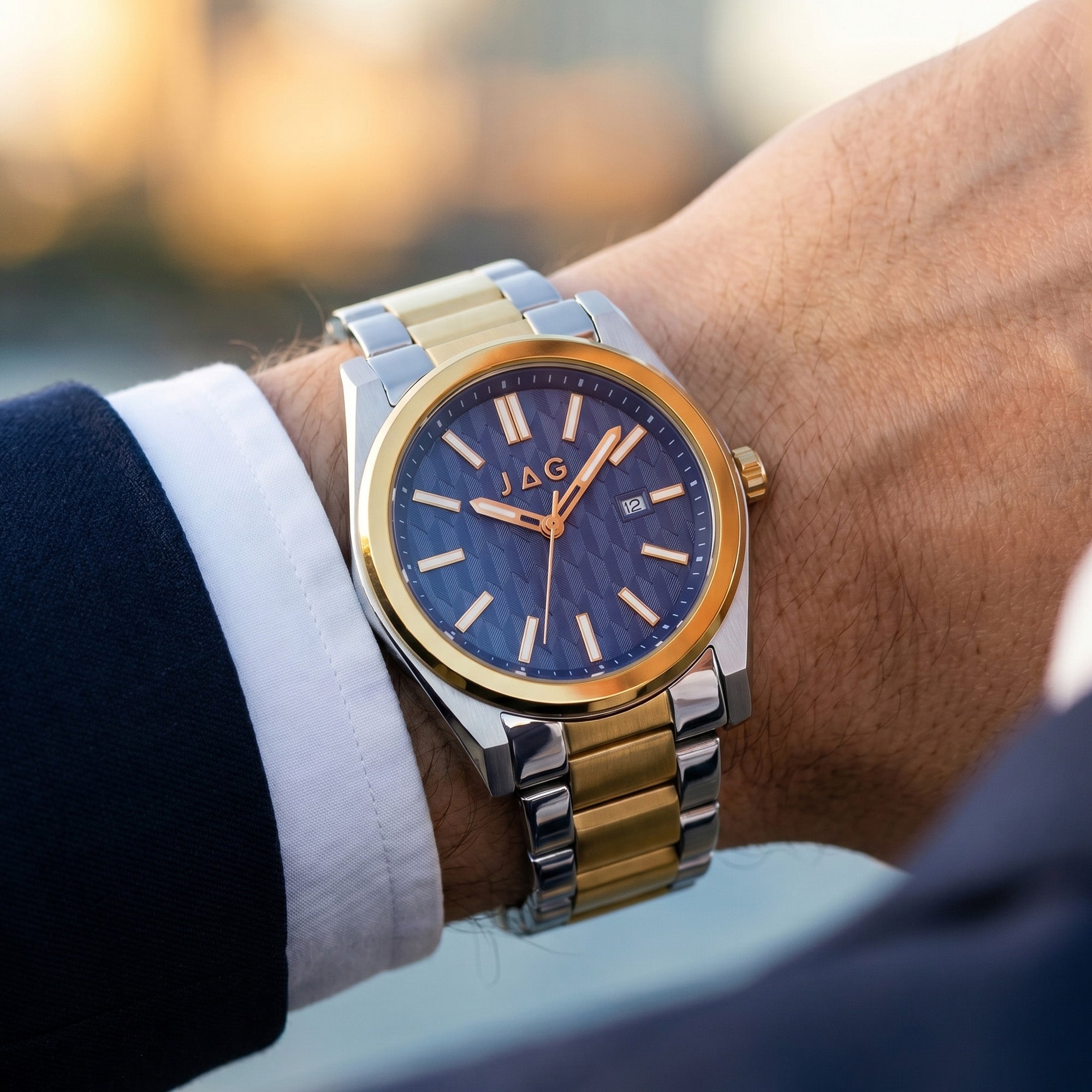 Close-up of a man wearing a JAG Beaufort blue dial two-tone men's watch on his wrist.