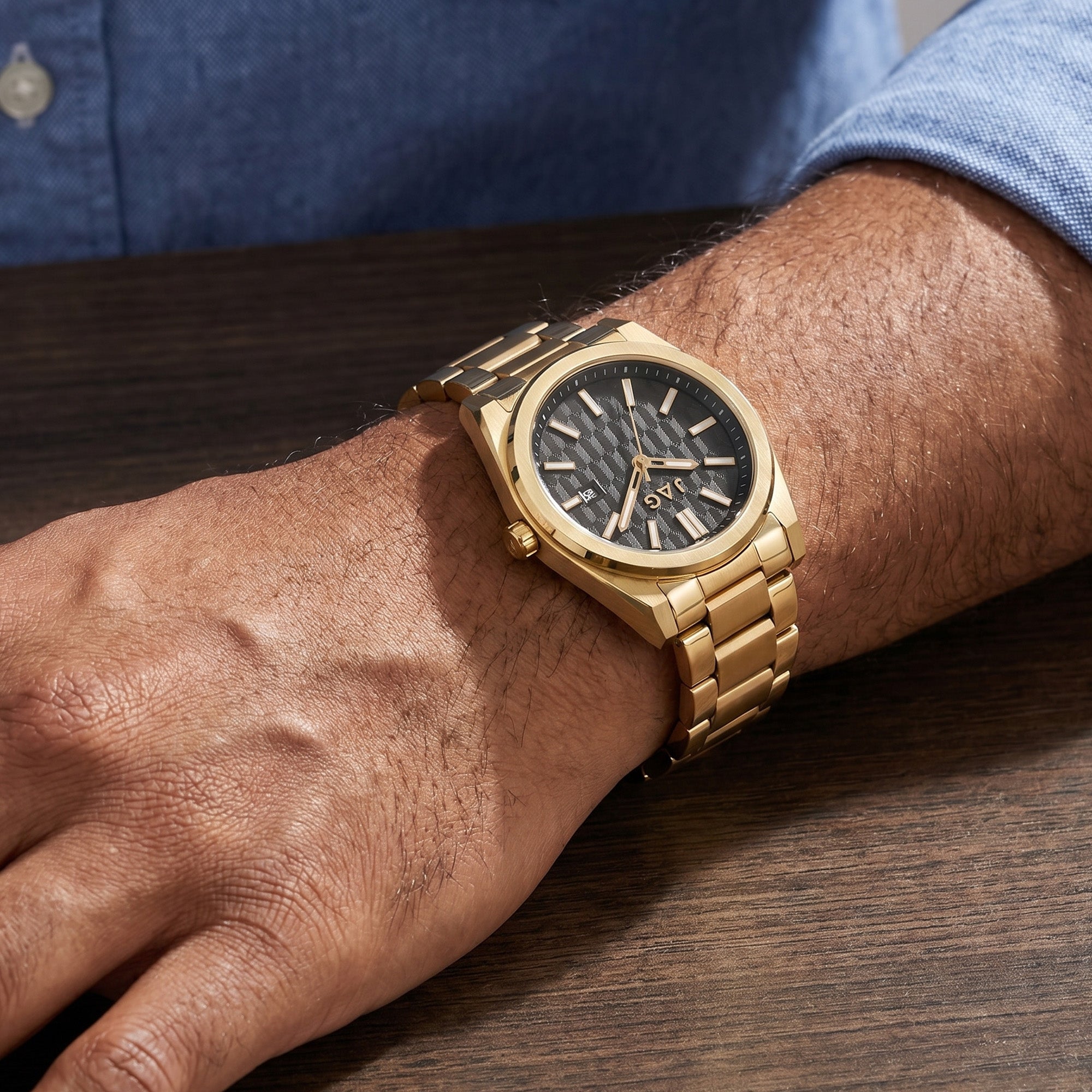 Man wearing a JAG Beaufort black dial gold men's watch.