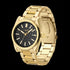 Side tilt view of JAG Beaufort black dial gold men's watch.