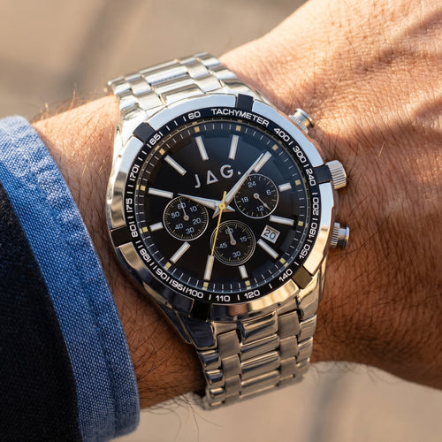 Man wearing JAG Boss black dial silver chronograph watch on his wrist.