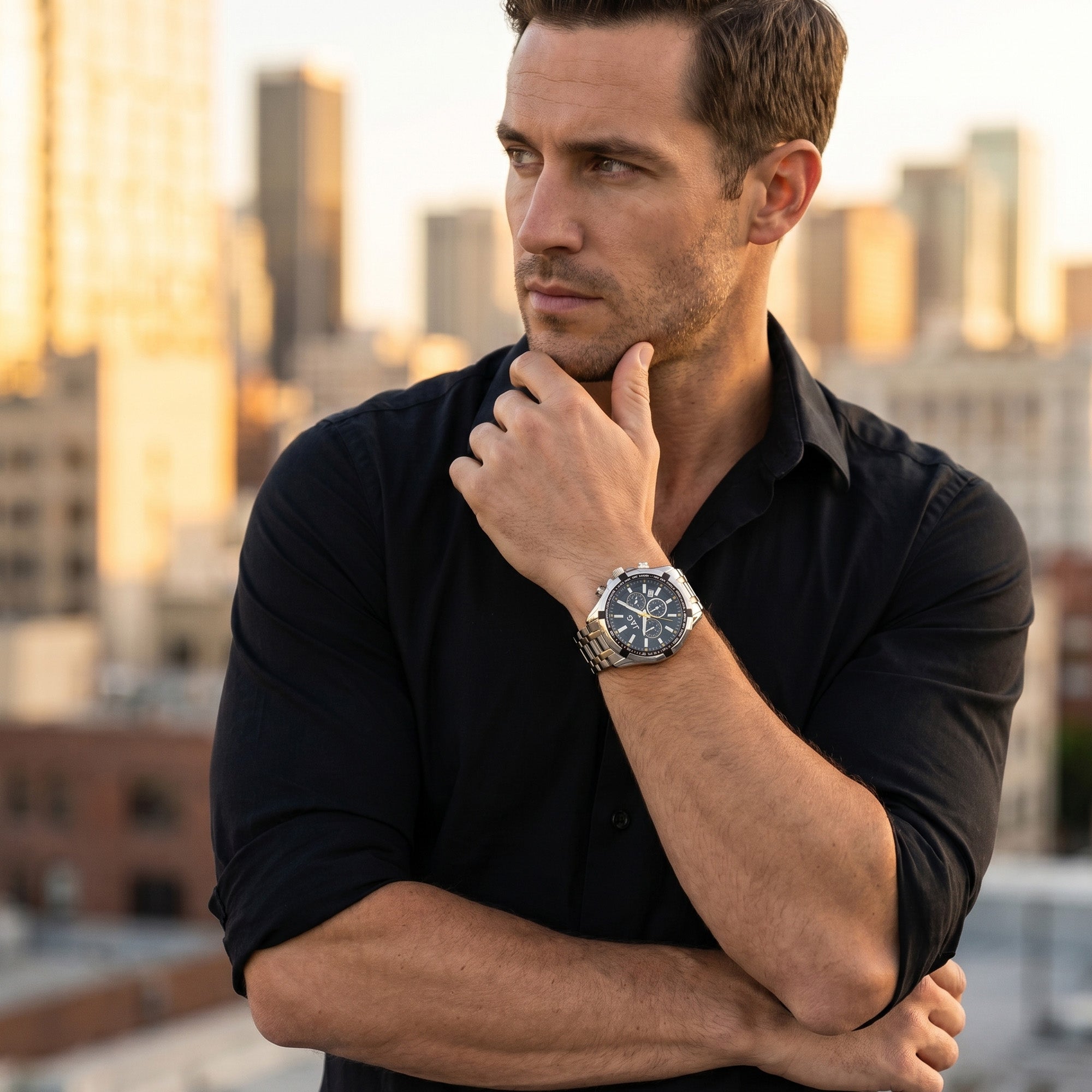 Man in a black shirt wearing a JAG Boss Black dial men's silver chronograph watch.