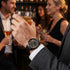 Man wearing a JAG Gerroa black transparent watch at a social gathering.